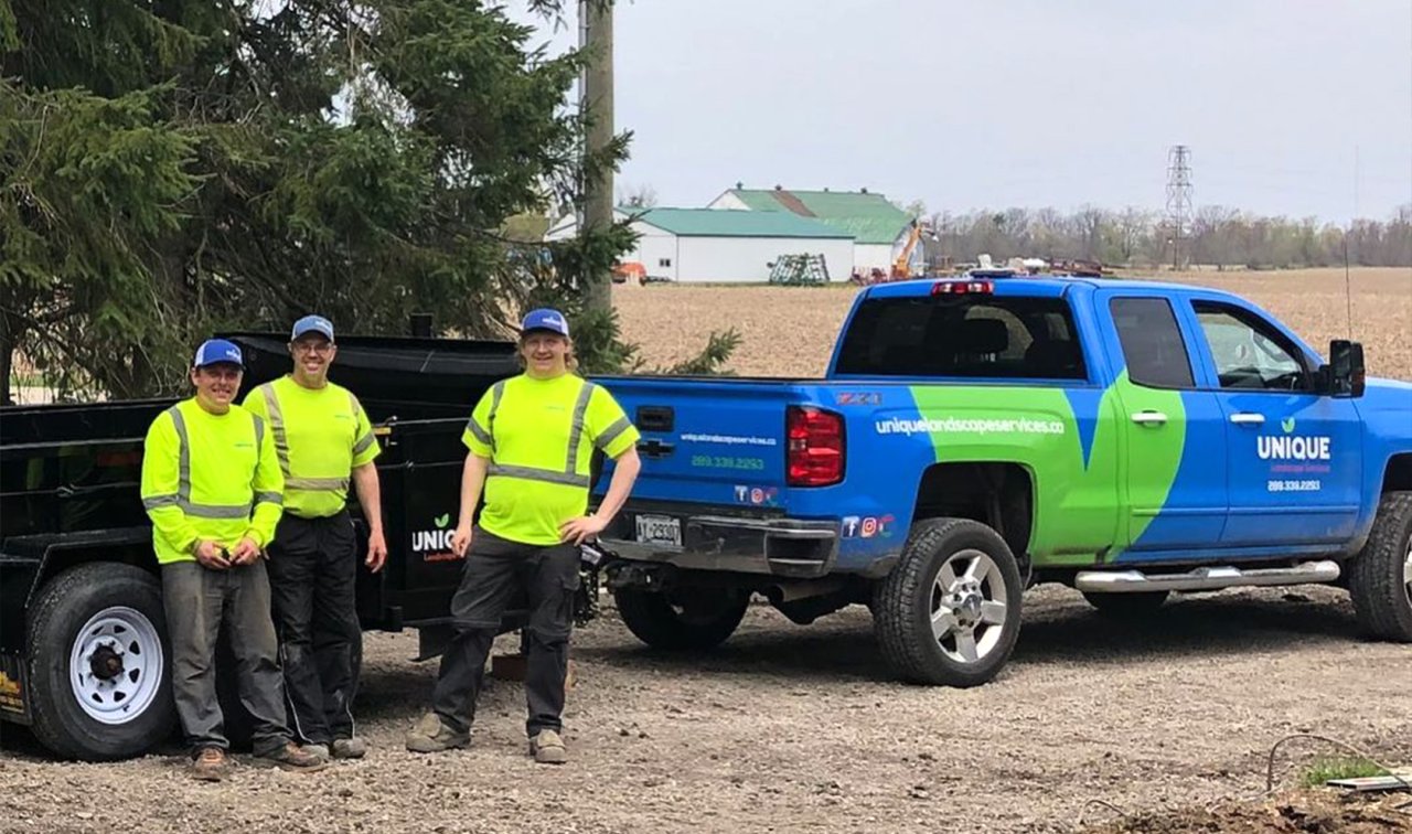 three workers with the truck